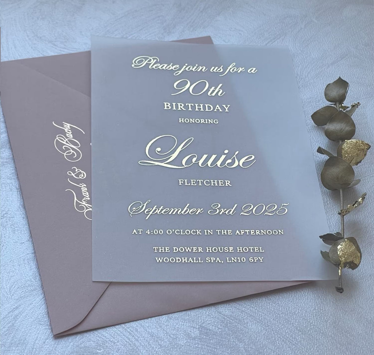 90th birthday invitation on translucent vellum with foil script, a personalized milestone invitation shown with an envelope.