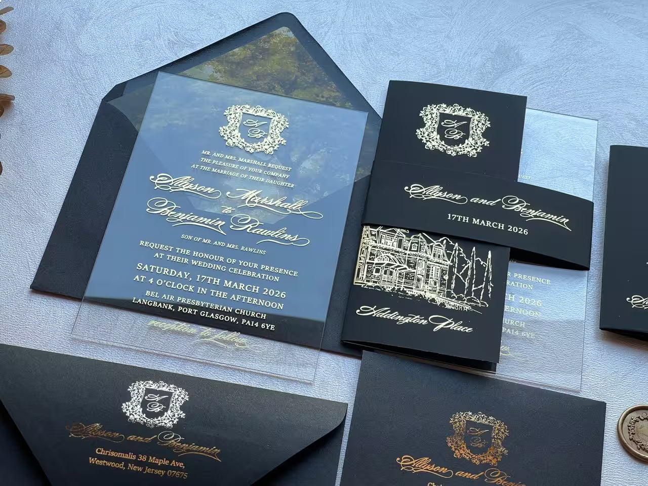 Acrylic wedding invitation with a custom gold foil sketch of the wedding venue