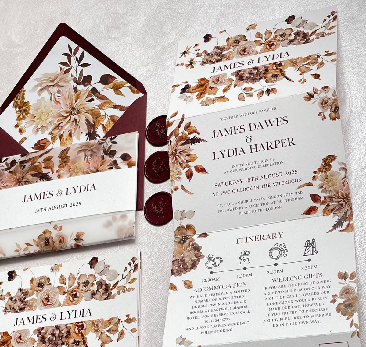 All in one wedding invitations wrapped in vellum jacket with fall floral design showing through
