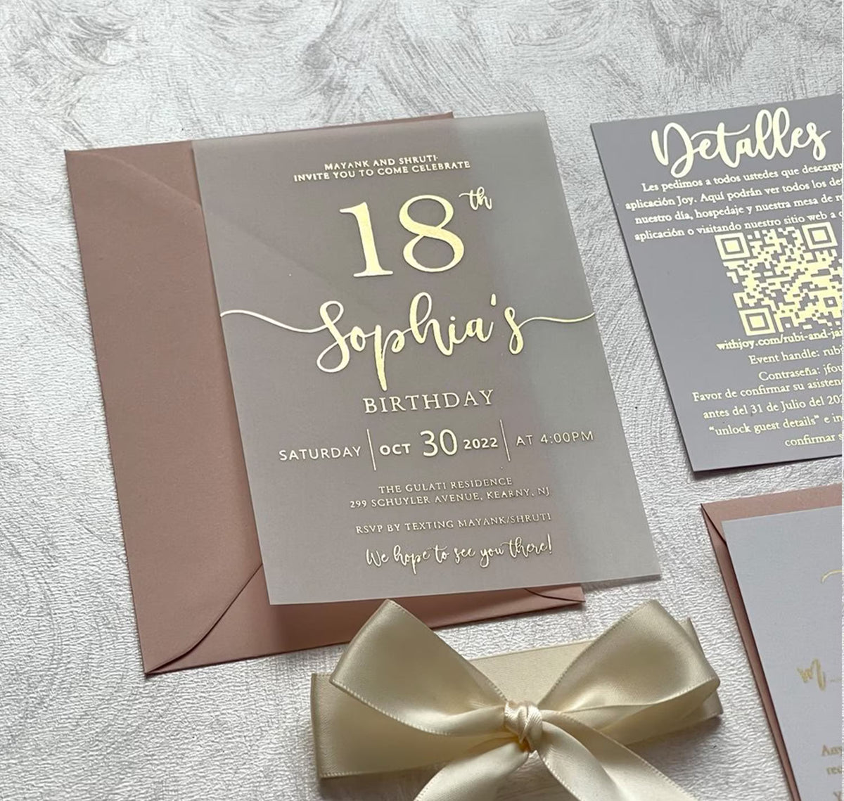 Birthday party invitations on translucent vellum with foil lettering, personalized with the name, age, date and venue.