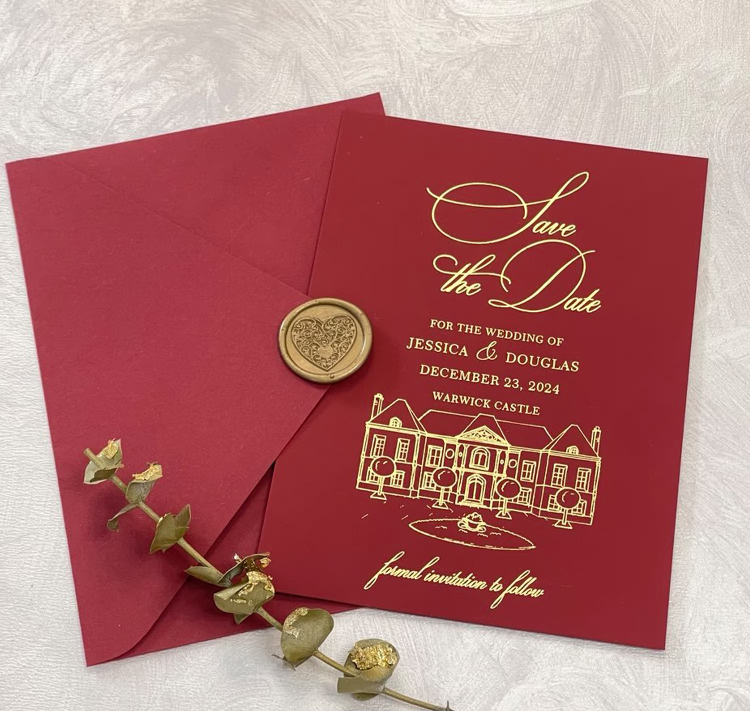Burgundy Save the Date card with custom wedding venue illustration and foil lettering