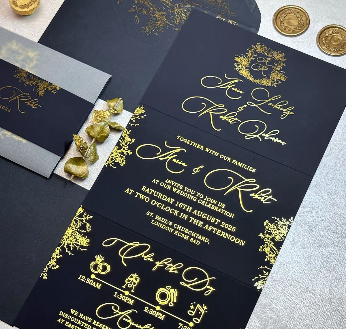 Concertina wedding invitations with foil on navy blue cardstock open showing personalized names, ceremony details and itinerary
