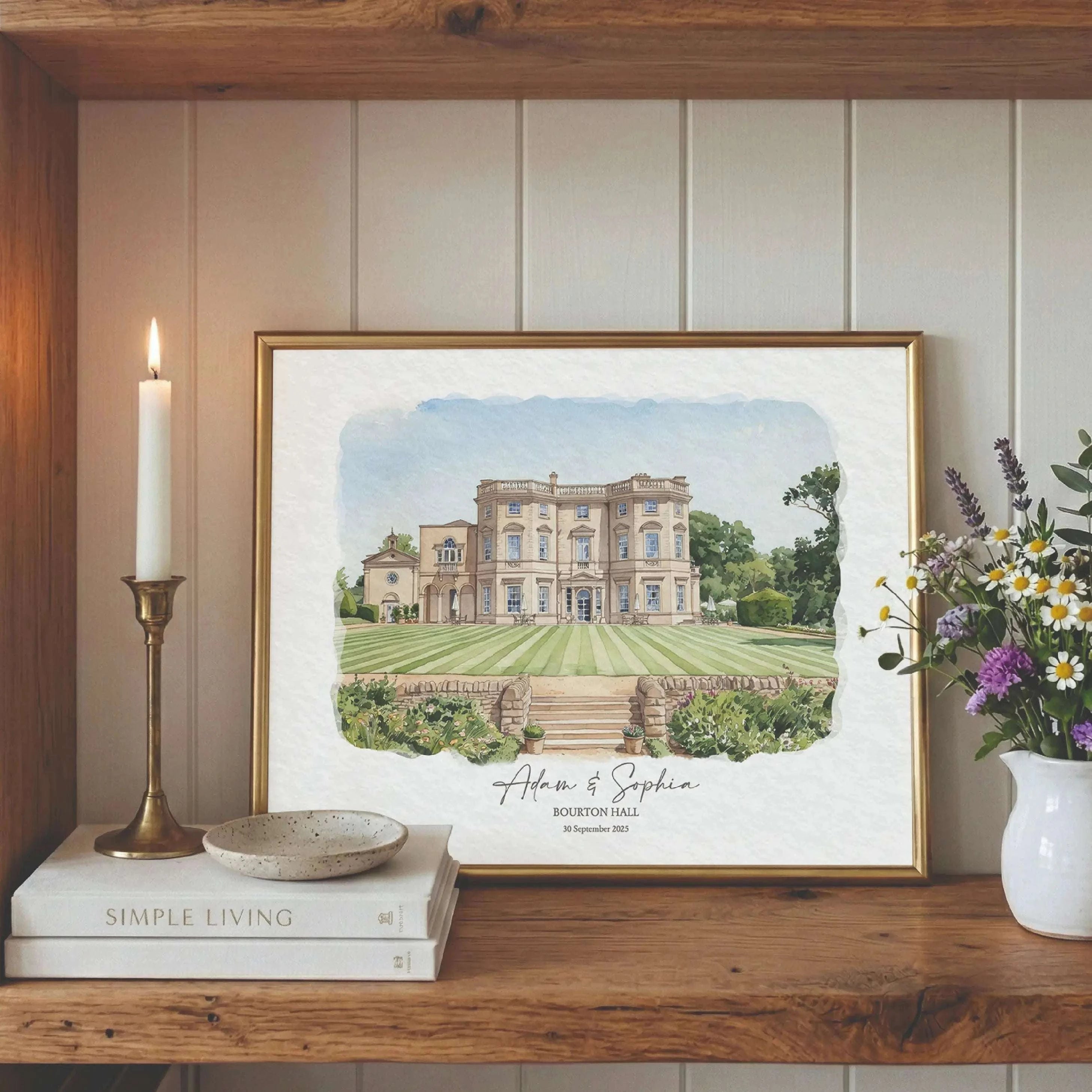 Custom watercolor print of Bourton Hall wedding venue displayed in an elegant gold frame with personalized names and wedding date
