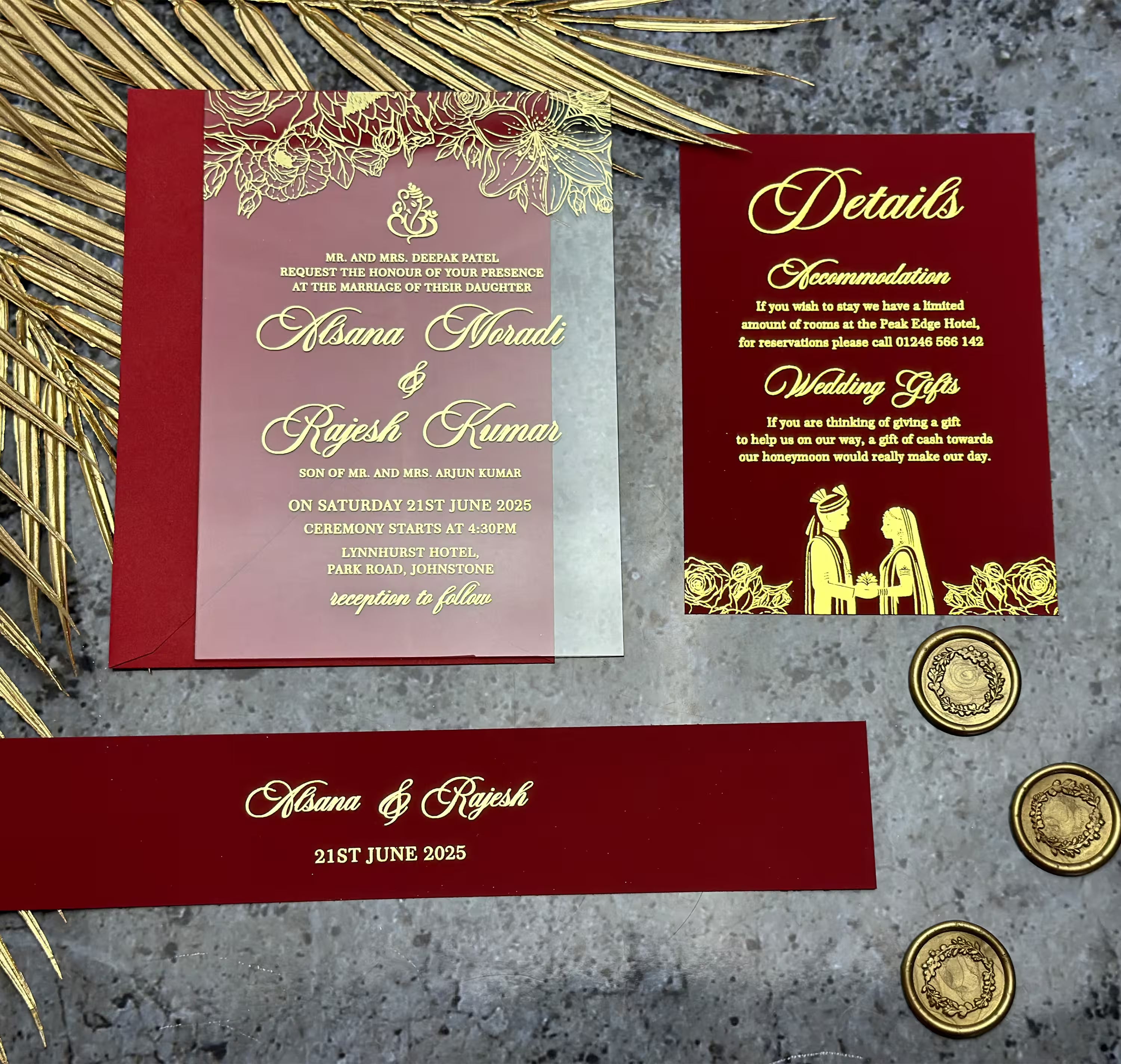 Flat lay of modern acrylic South Asian wedding invitations with elegant gold detailing, curated for a contemporary celebration