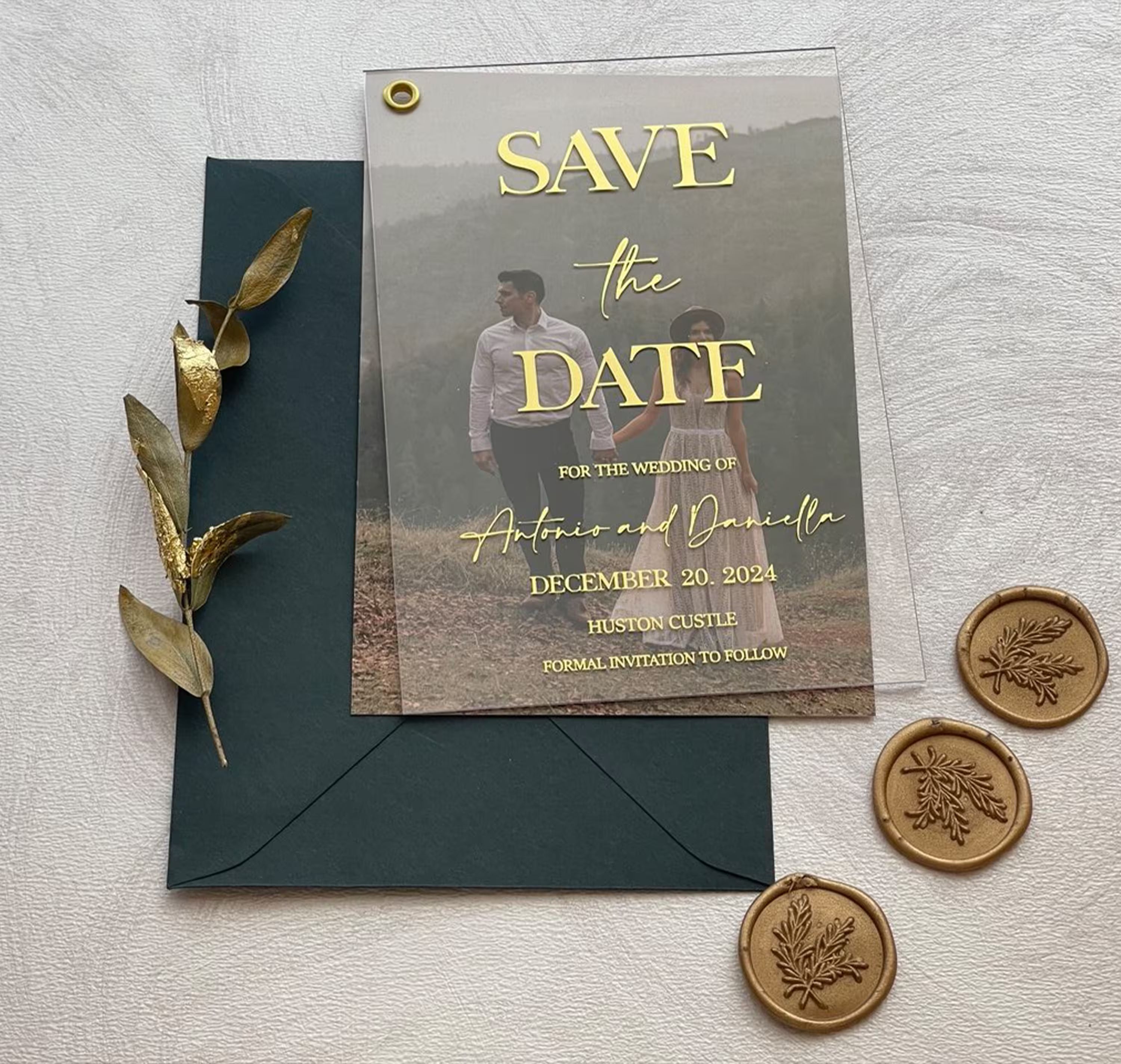 Clear acrylic wedding Save the Date featuring a couple photo and foil details