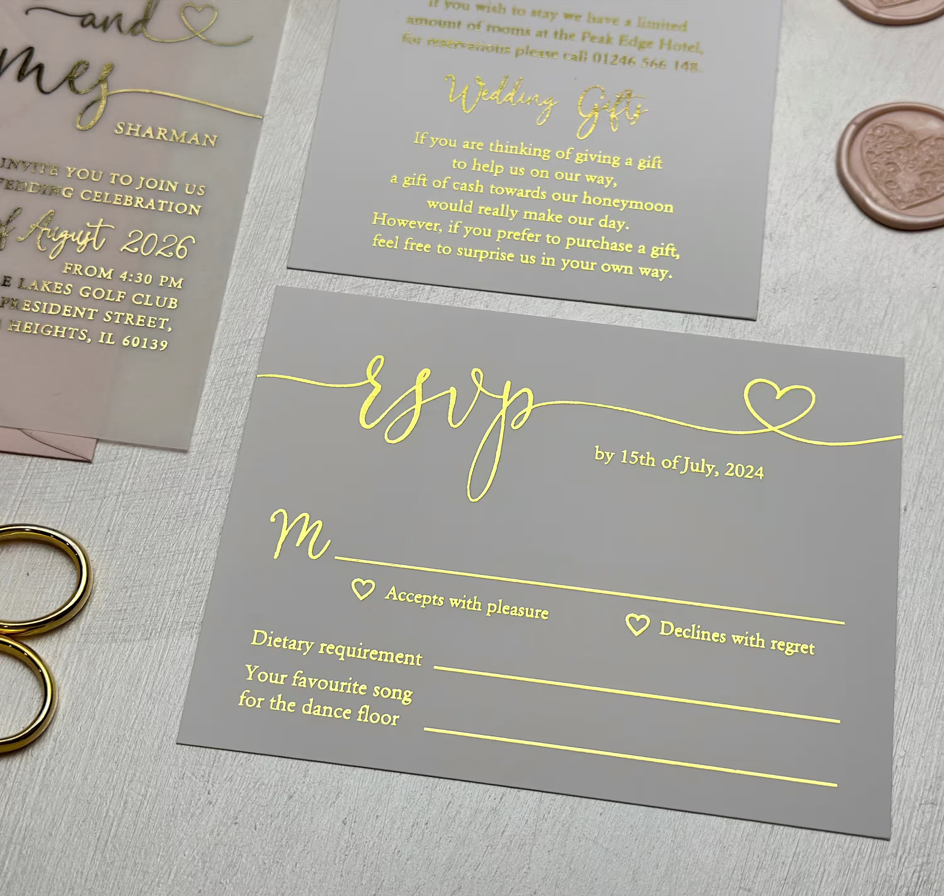 Modern wedding vellum invitation featuring expressive typography, elegant foil and a heart-shaped glyph
