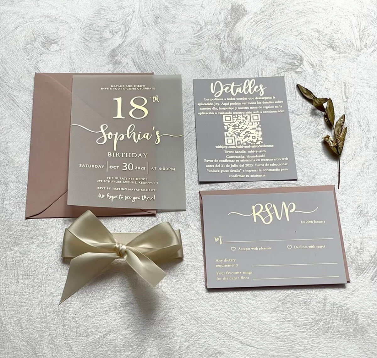 Personalized birthday invitations on soft vellum shown with an envelope, foil script glowing through the translucent sheet.