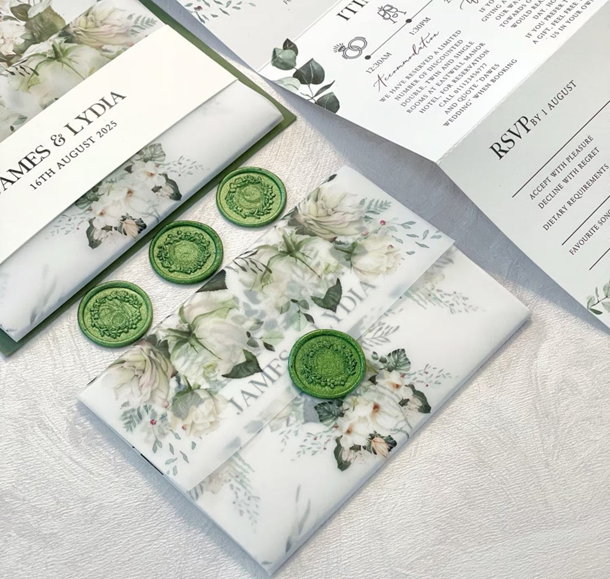 Sage green concertina wedding invitations with floral envelope liner and matching wax seal