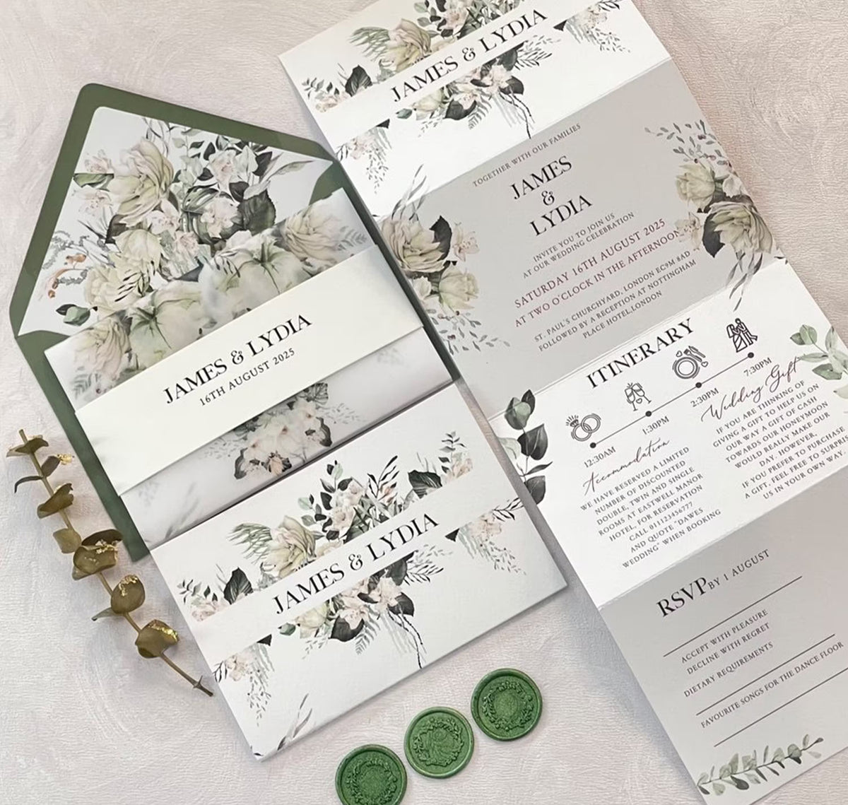 Sage green concertina wedding invitations suite open showing floral design with ceremony and RSVP details