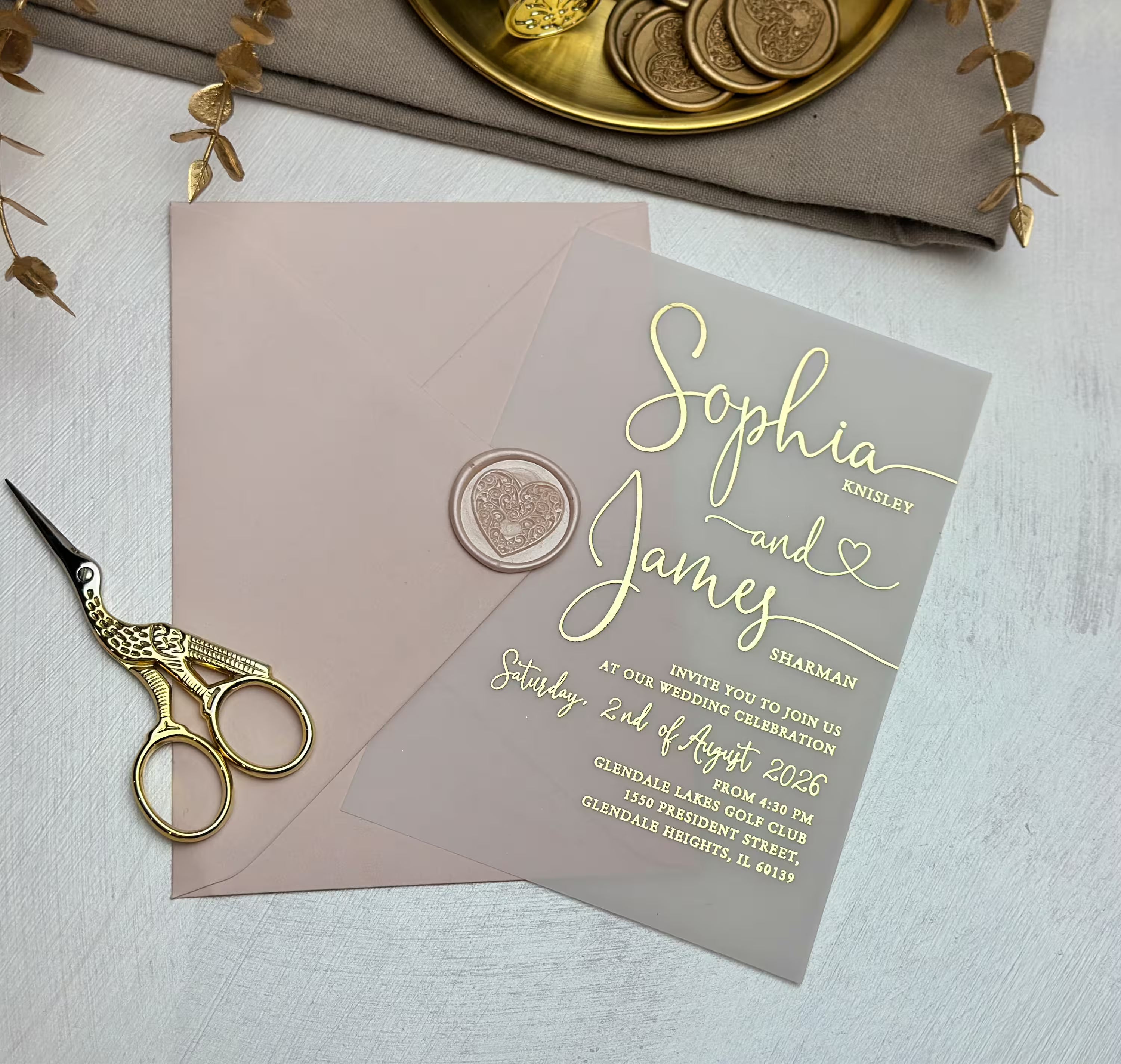 Refined wedding vellum invitation with translucent paper, foil typography, romantic script and heart detail