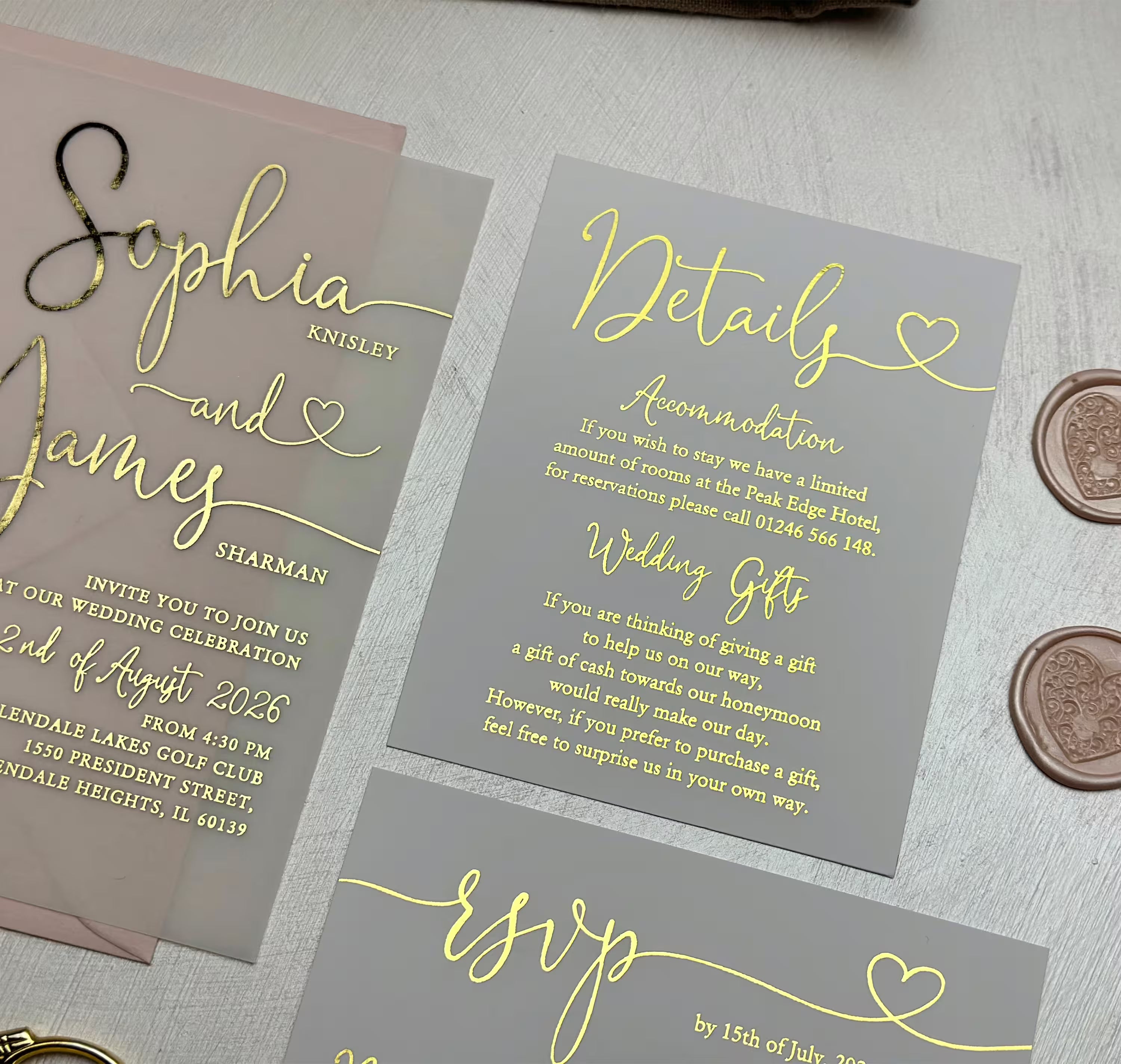 Elegant vellum wedding invitation with foil lettering, flowing script and subtle heart detail