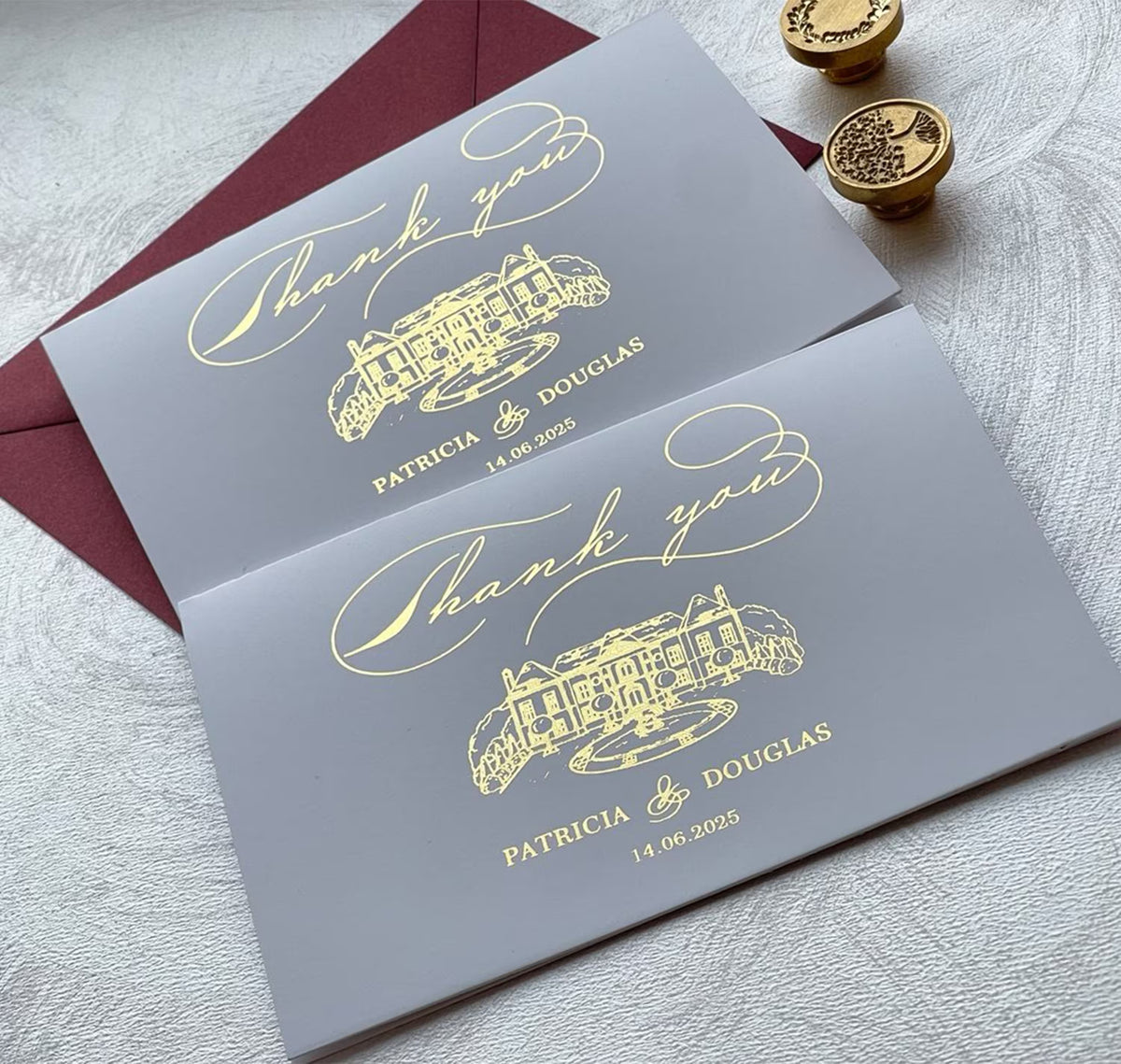 Custom wedding thank you cards featuring personalized names and venue illustration