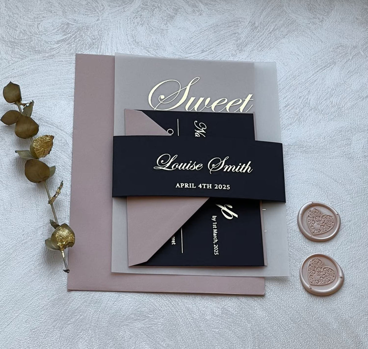 Close-up of foil lettering on 16th birthday invitations, vellum card personalized for a sweet sixteen celebration.