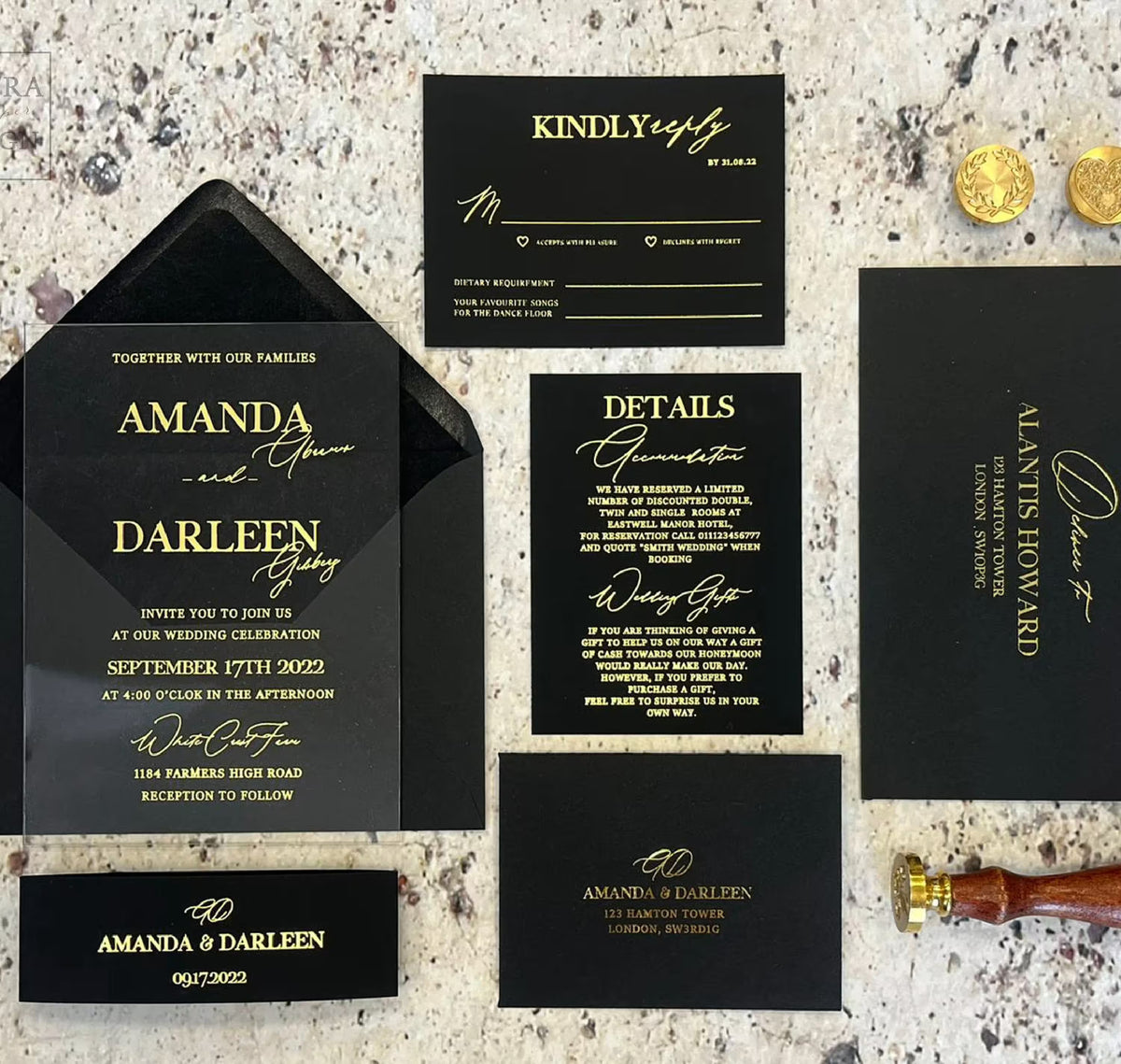 Close up of custom acrylic glass wedding invitation with personalized foil names, date and venue on clear acrylic