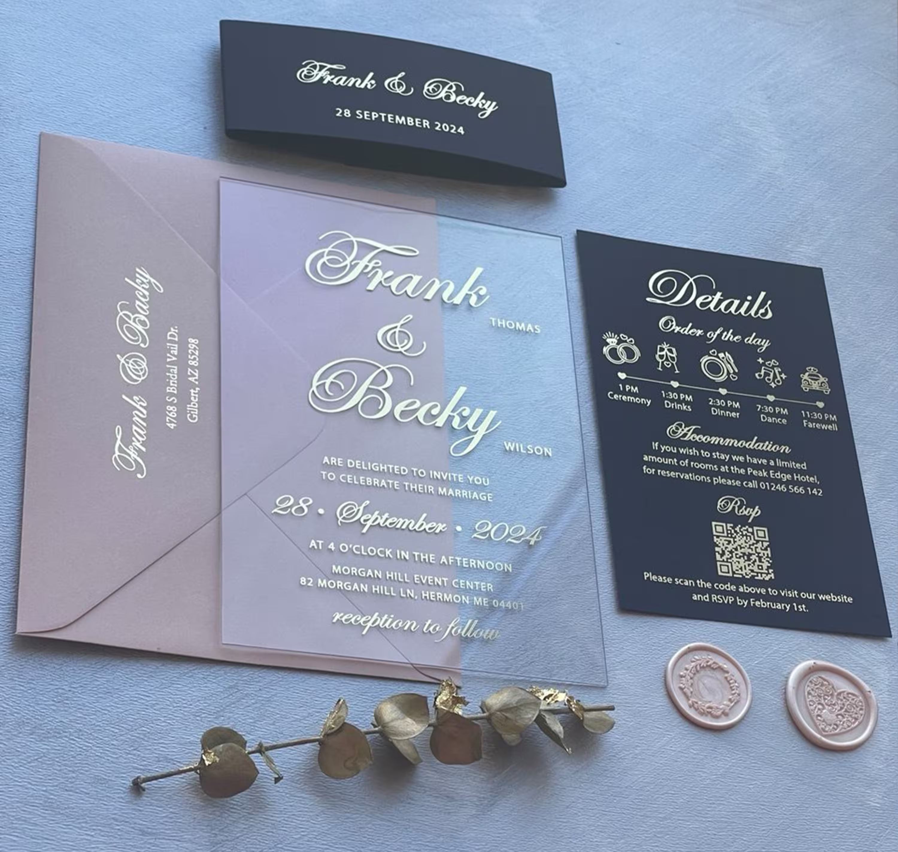 Clear acrylic wedding invitation with foil names, paired with a blush envelope, navy belly band and a details card with a QR code RSVP