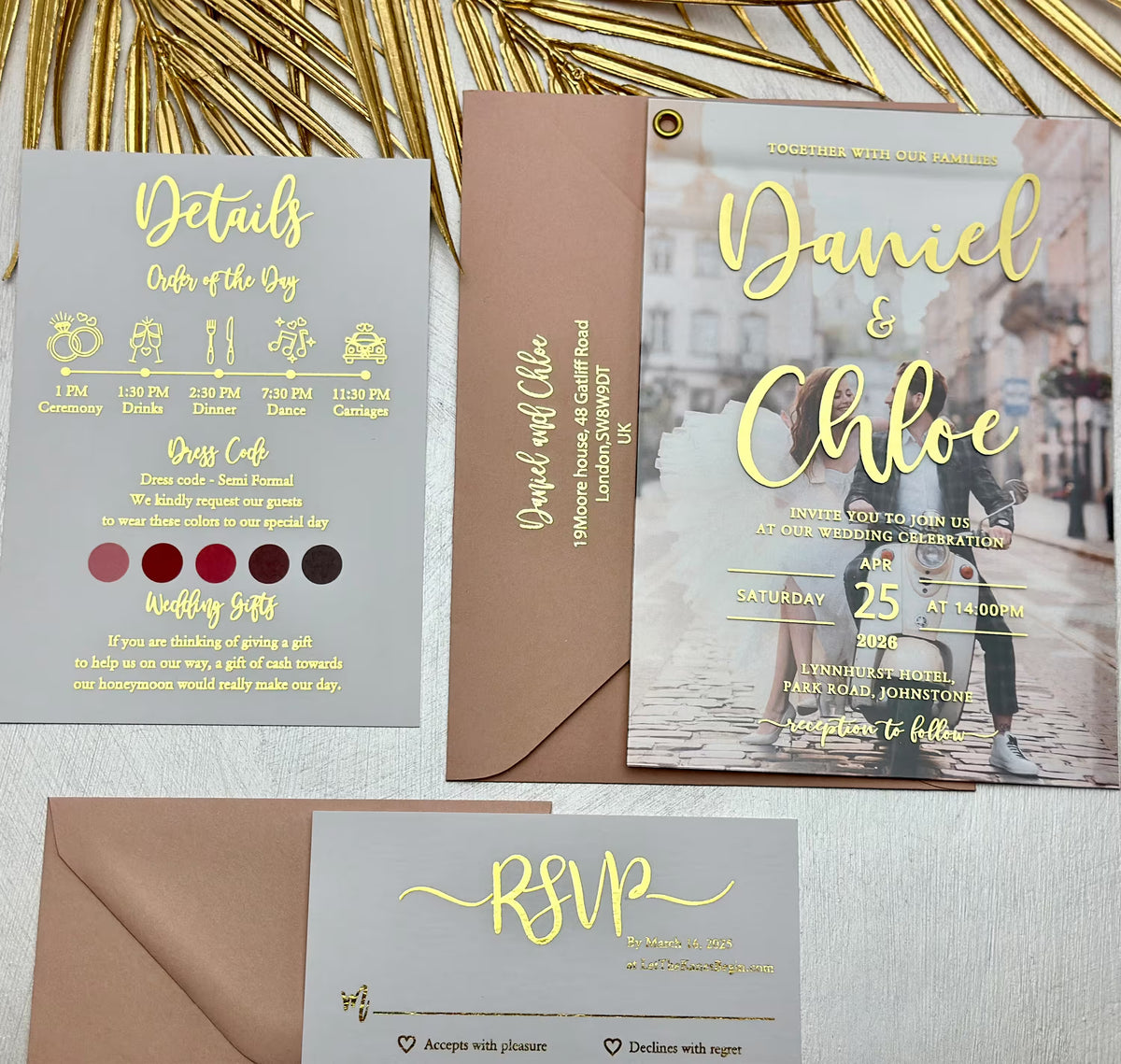 Close up of acrylic wedding invitation with couple photo and personalized foil lettering with names and wedding date