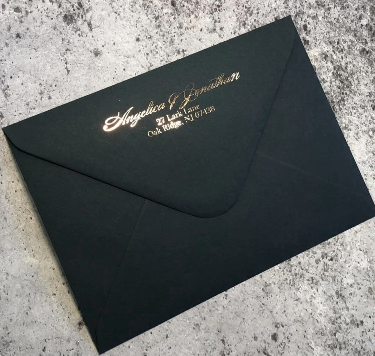 Addressed wedding envelopes with elegant gold printing