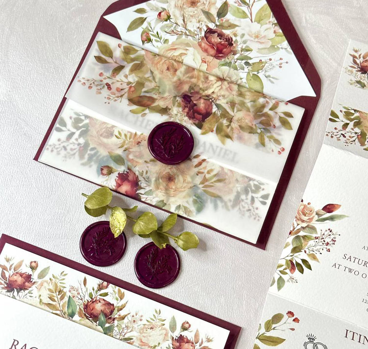 Burgundy floral concertina wedding invitations all in one suite open showing itinerary and RSVP panels