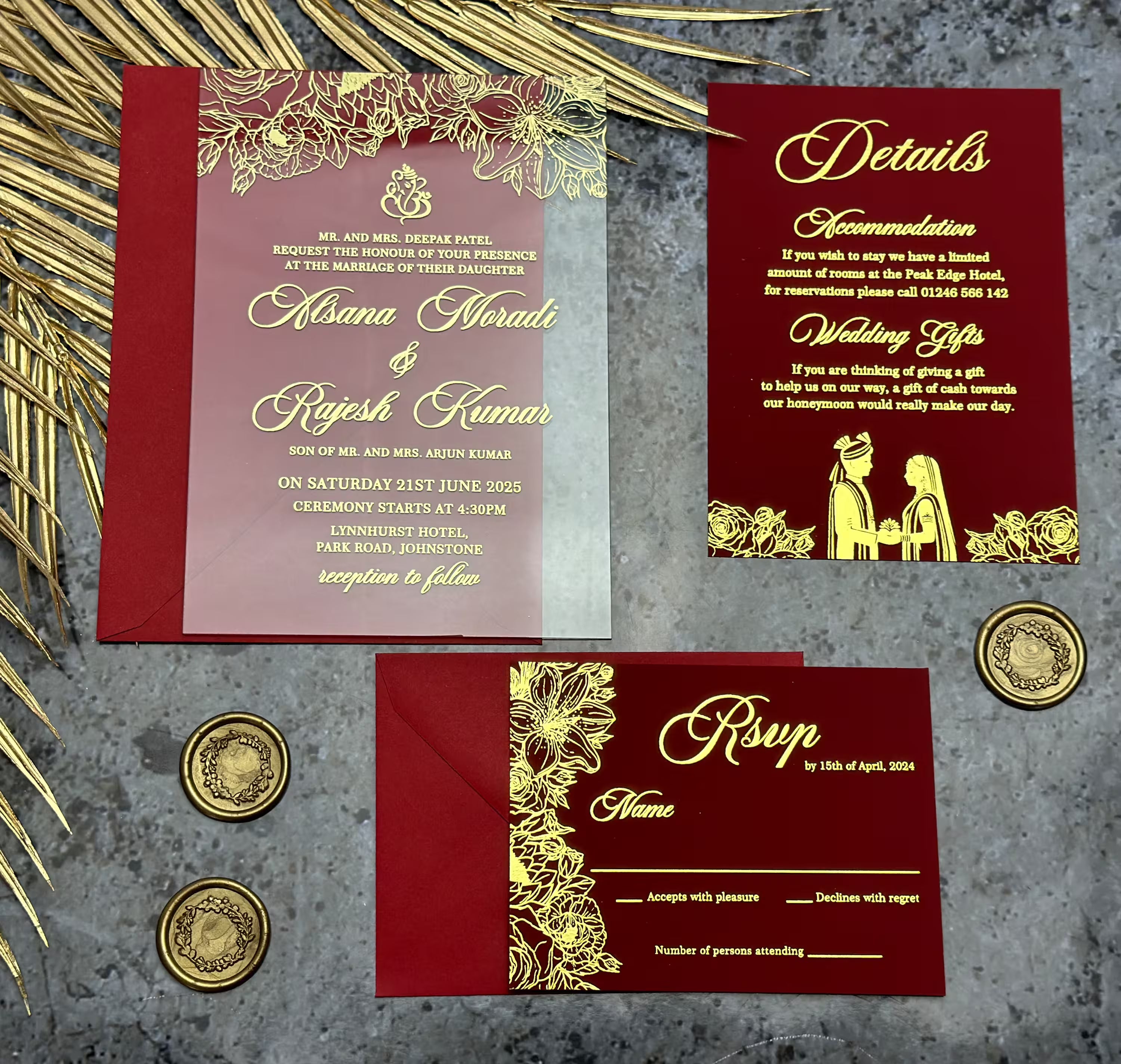 Elegant burgundy and gold acrylic Indian wedding invitation suite with matching RSVP card and custom details inserts