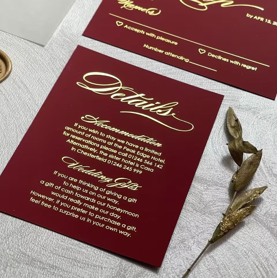 Burgundy details card with gold foil calligraphy and a matching RSVP card