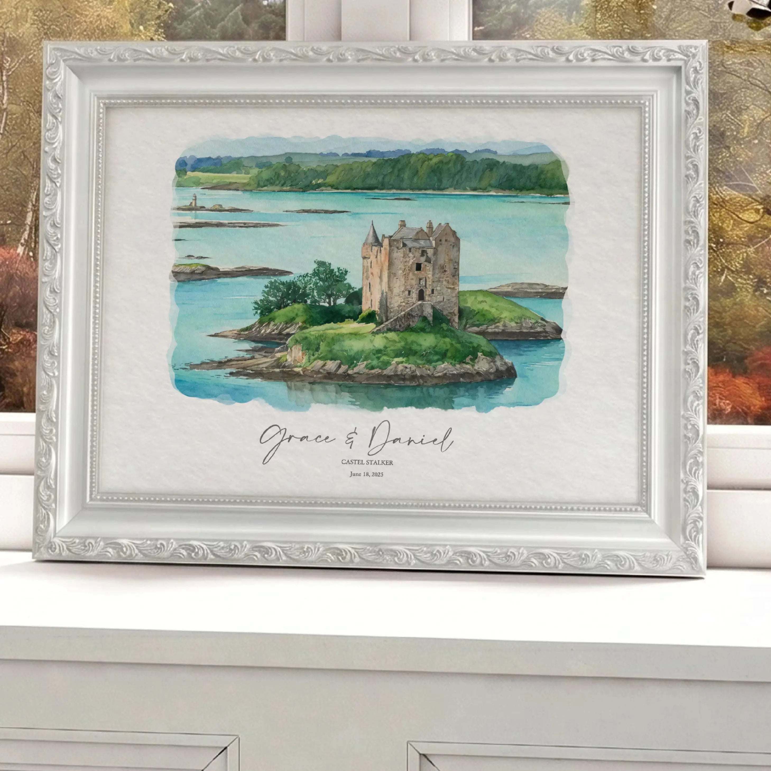 Personalized watercolor portrait of Castle Stalker, Appin, Scotland displayed in an ornate white frame, featuring custom wedding names and date beneath the artwork.