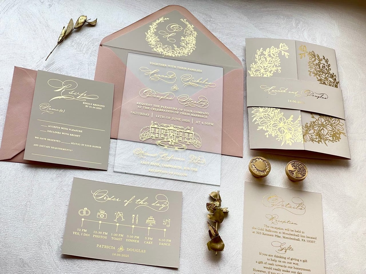 Transparent acrylic wedding invitation with venue sketch under a foiled belly band