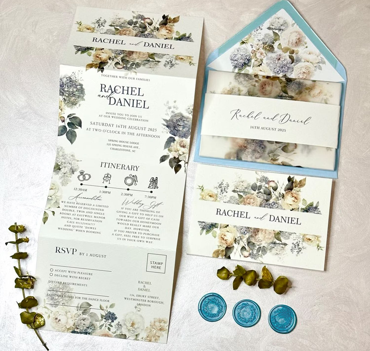 Concertina wedding invitations in dusty blue palette with vellum jacket personalized with names and wedding date