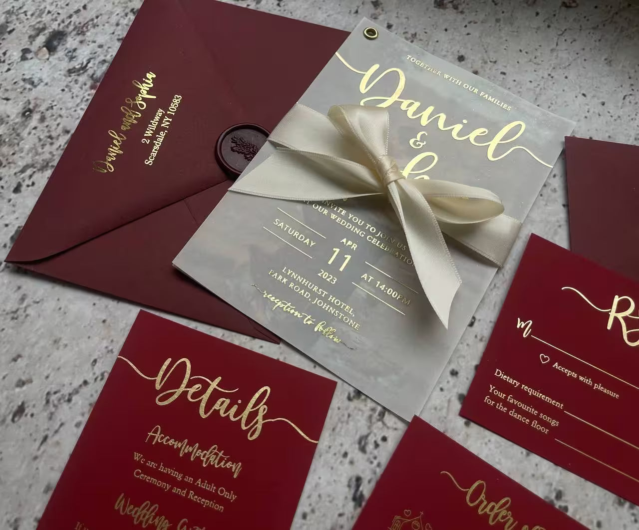 Gold foil vellum wedding invitation with a wax seal, burgundy envelope, and matching details and RSVP cards, available in custom colors