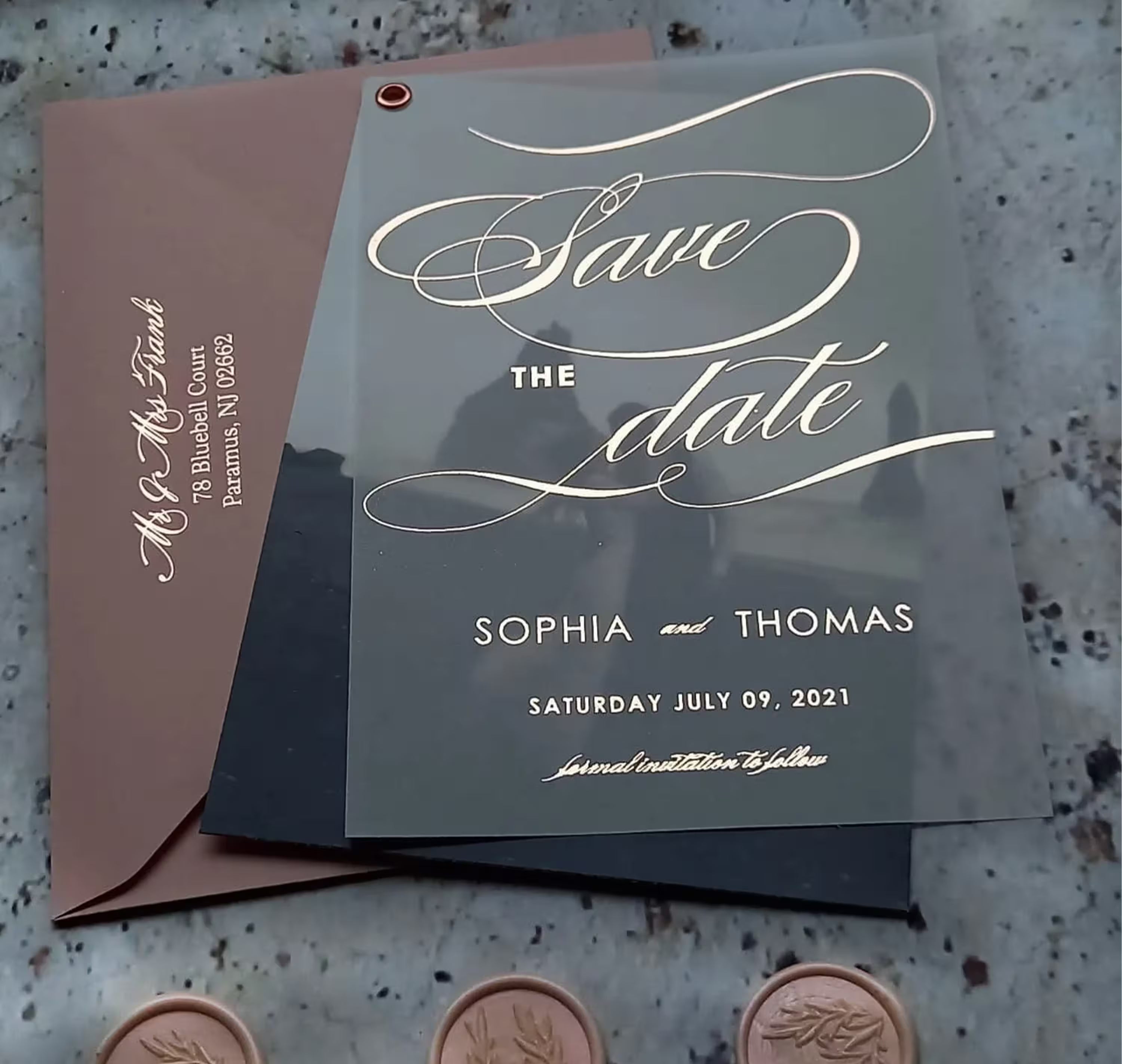 Elegant vellum Save the Date featuring sweeping rose gold foil calligraphy