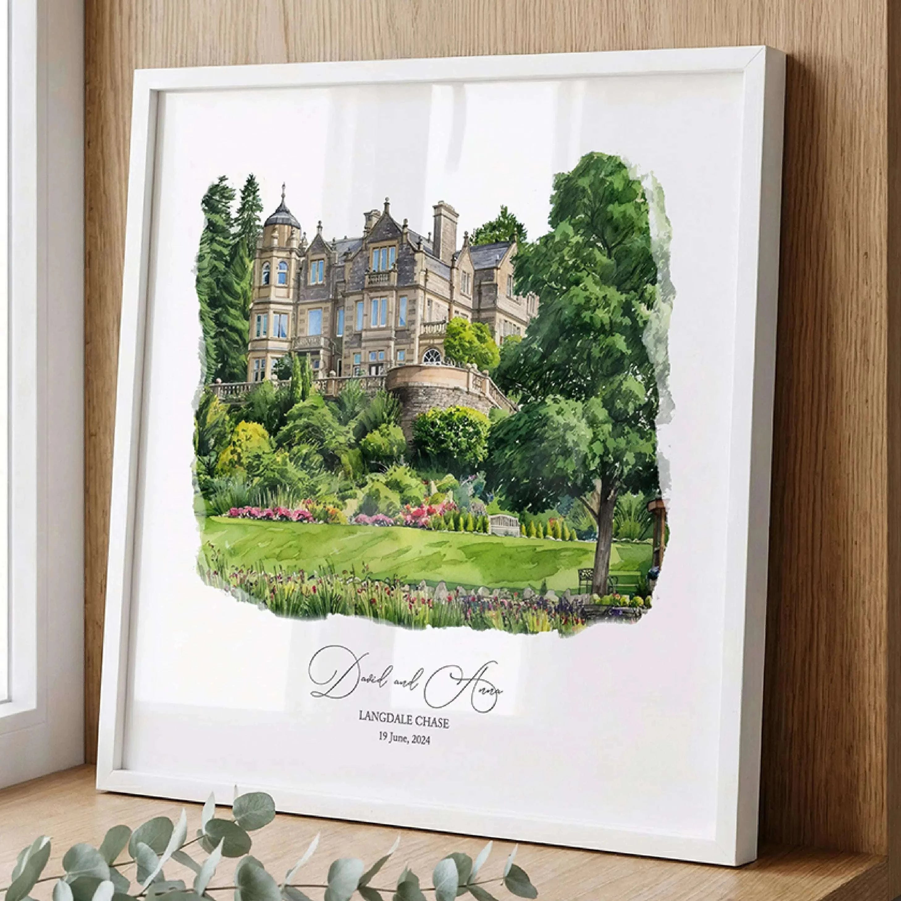 Elegant watercolor painting of Langdale Chase wedding venue in a gold frame, personalized with couple names and wedding date, luxury custom wedding venue portrait gift.