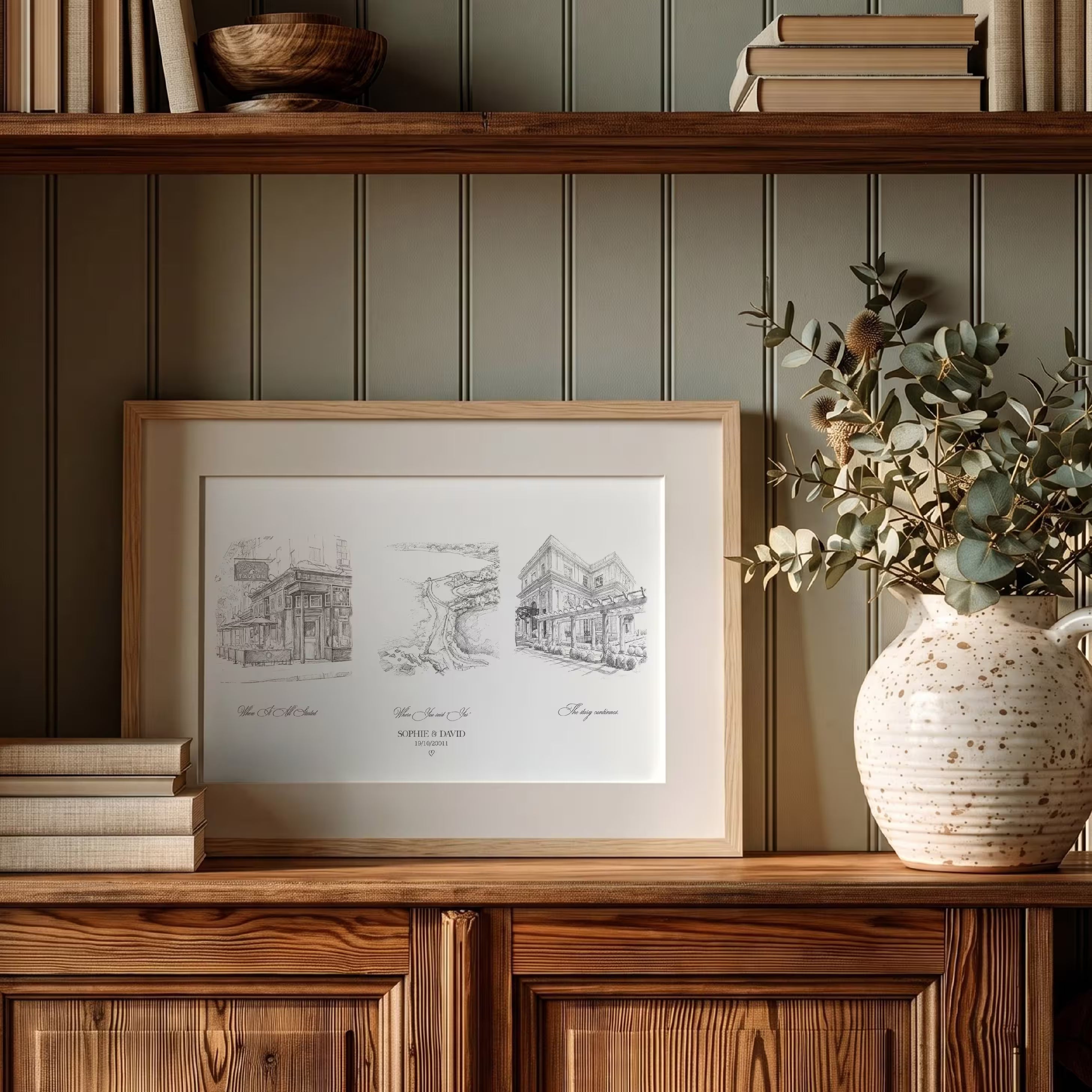 Personalized pencil sketch love story print in a gold frame, three graphite venue scenes with a pink house, a pineapple fountain, and a columned manor, created from your photos with the couple names and date, an anniversary gift for couples