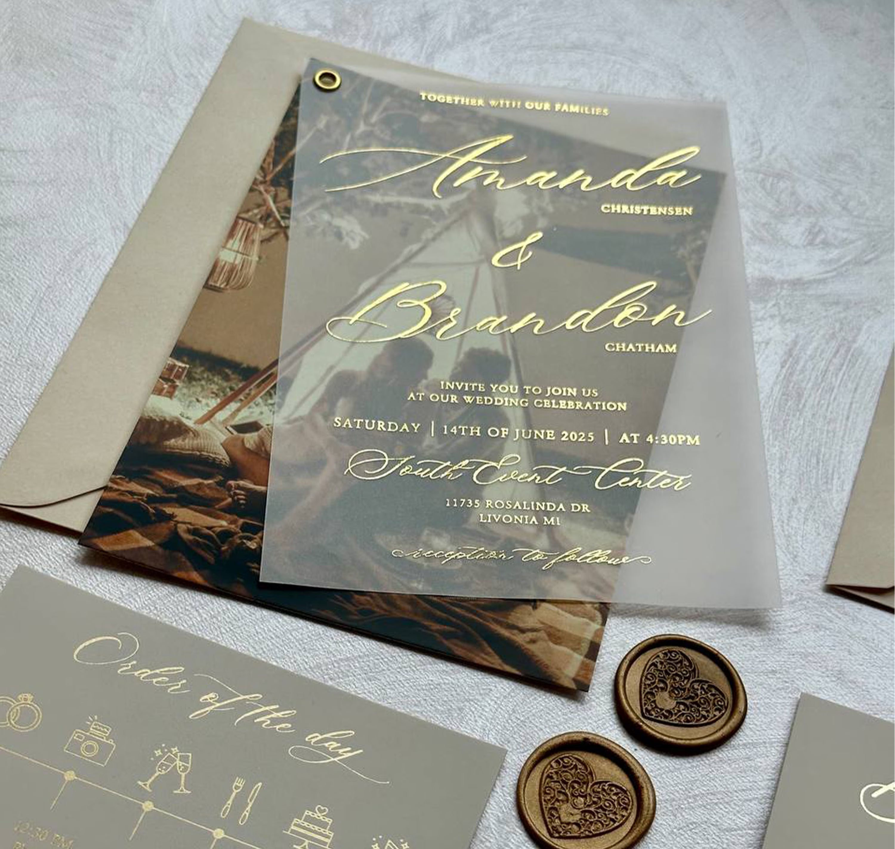 Photo wedding invitation card on vellum with foil names over a couple's picture