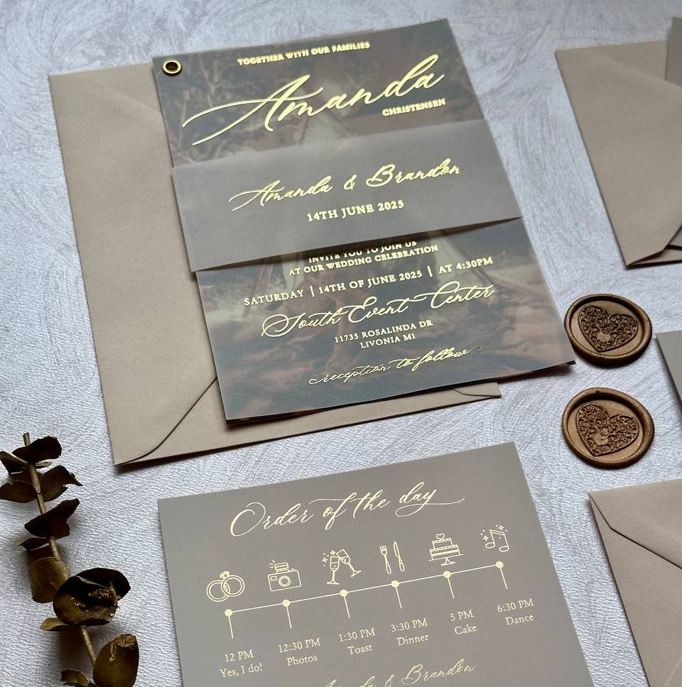 Picture wedding invitation on vellum with foil calligraphy over a photo, with neutral envelope