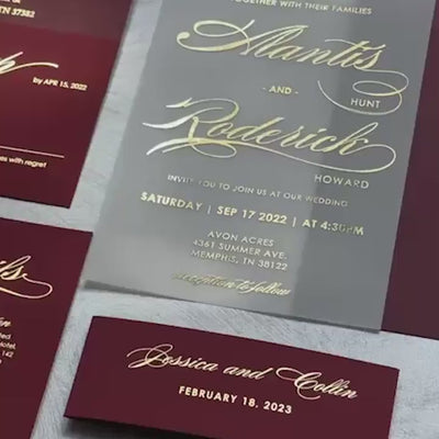 Burgundy and gold vellum wedding invitation suite with matching RSVP, details cards, envelope, and belly band