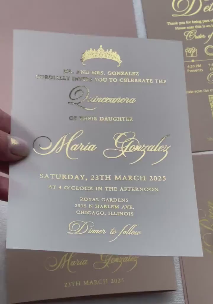 Video of quinceañera invitations on vellum with a foil tiara and script lettering, personalized 15th birthday invitation.