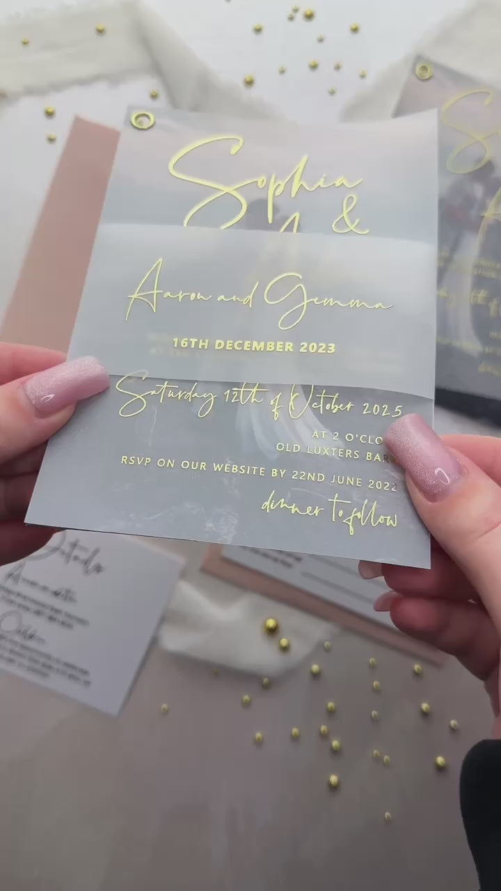 Foil vellum wedding invitation suite with RSVP card and gold foil names over a couple photo