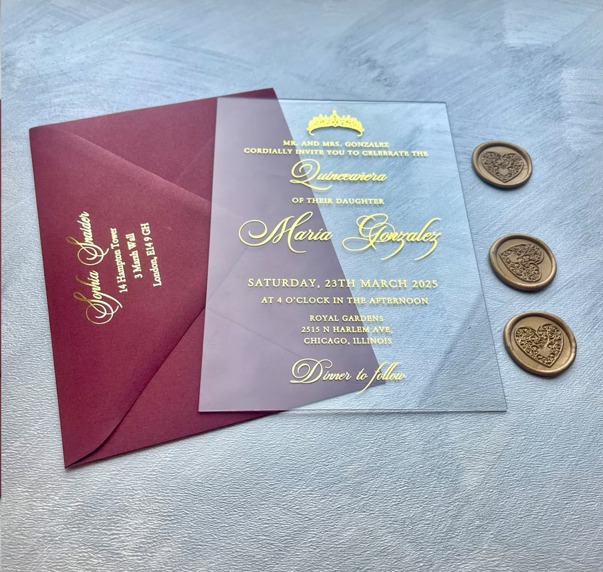 Quinceañera acrylic invitations with a formal invitation from the parents, foil details floating on a transparent sheet.