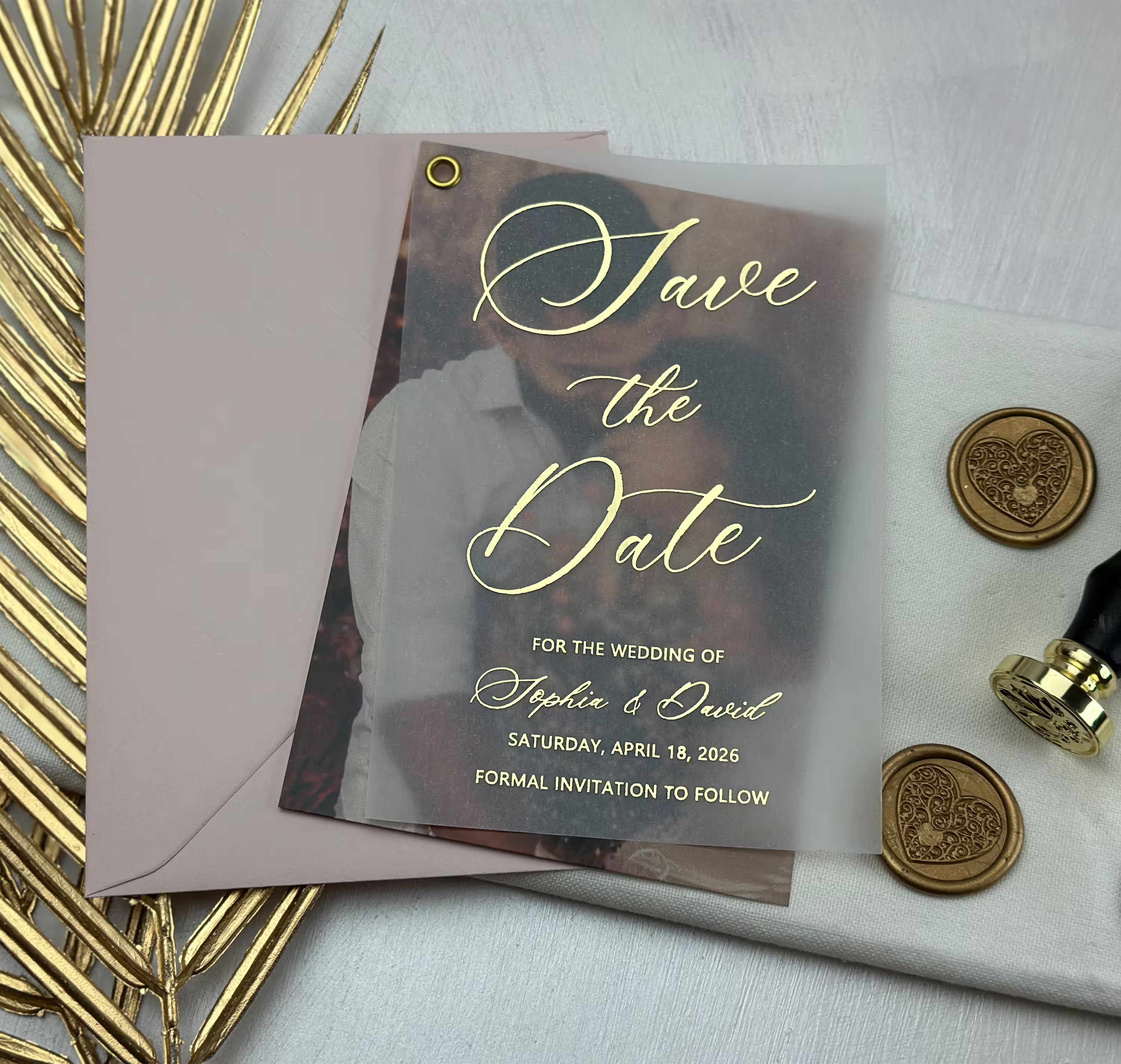 Save the dates with pictures featuring a personalized photo beneath translucent vellum and elegant foil