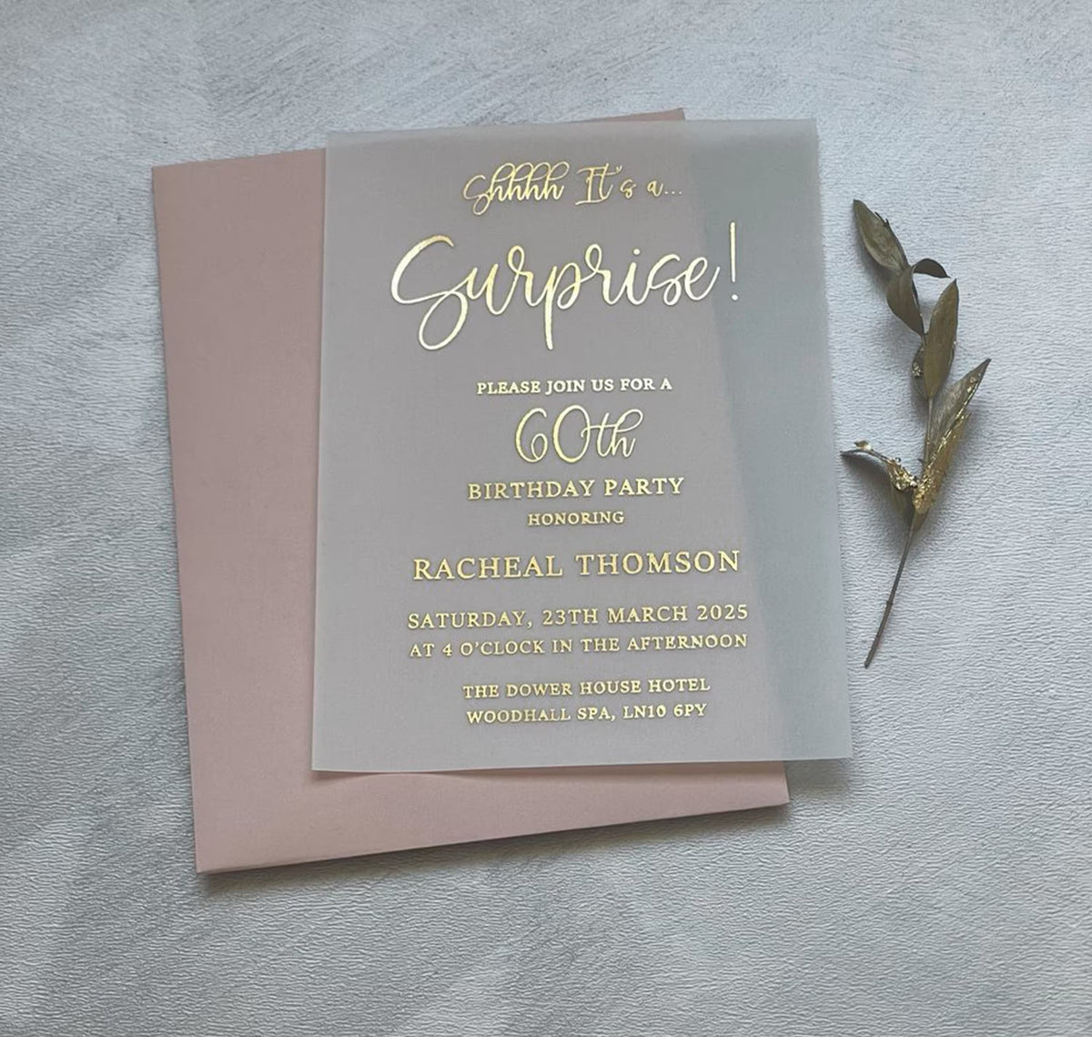 Personalized surprise birthday invitations for an adult celebration, vellum card with foil script that reads Shhhh it’s a surprise.