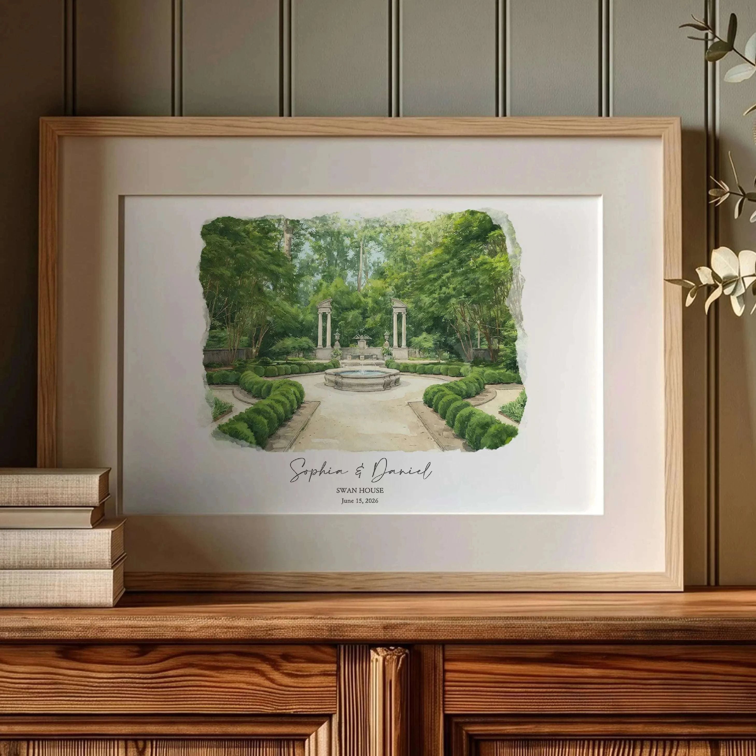Framed watercolor portrait of Swan House wedding venue displayed as elegant wall art. Personalized from a wedding photo and beautifully presented in a gold frame, this custom venue portrait makes a thoughtful first anniversary gift and lasting wedding memory.