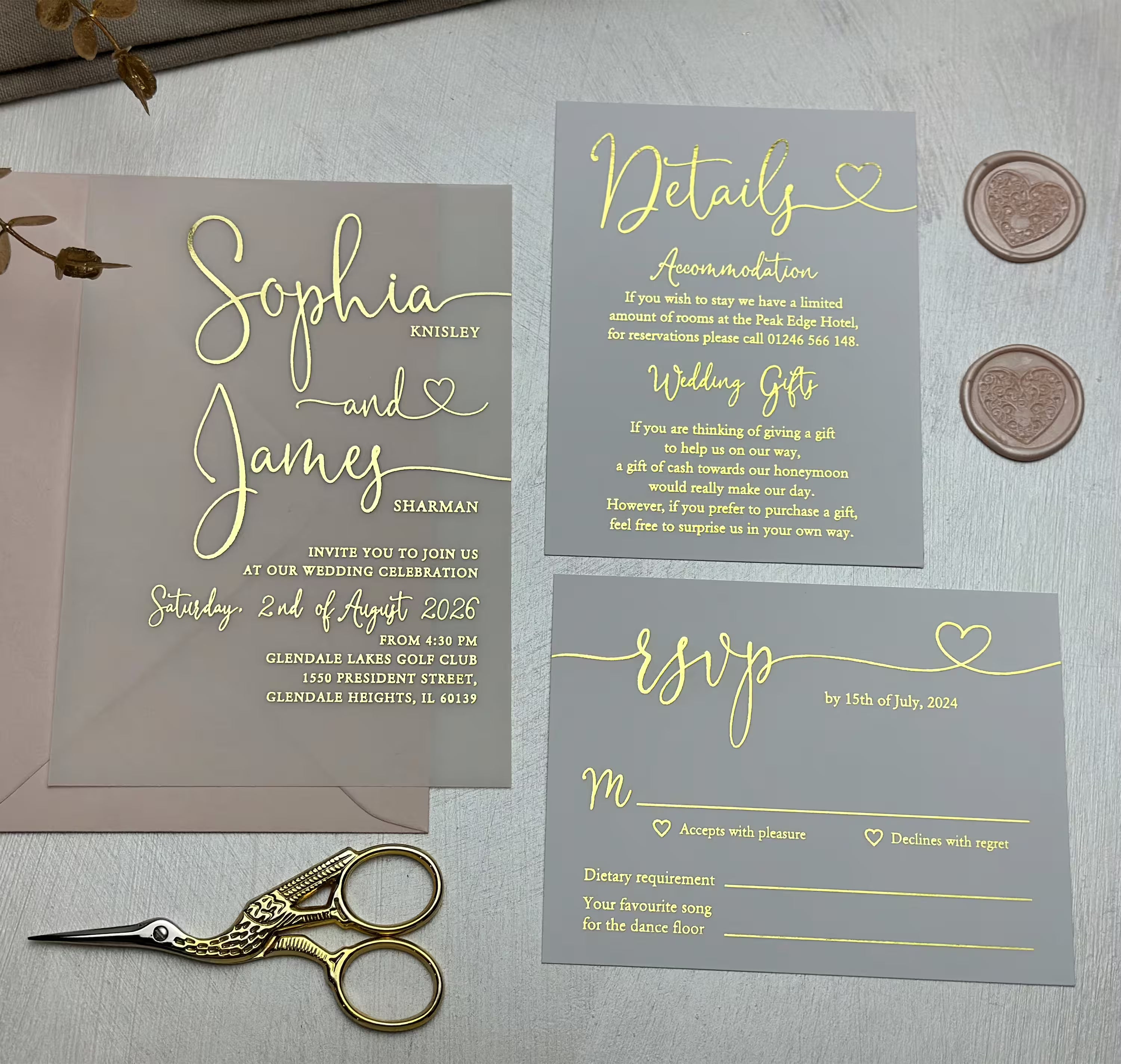 Vellum paper wedding invitation with romantic typography, foil details and a delicate heart glyph