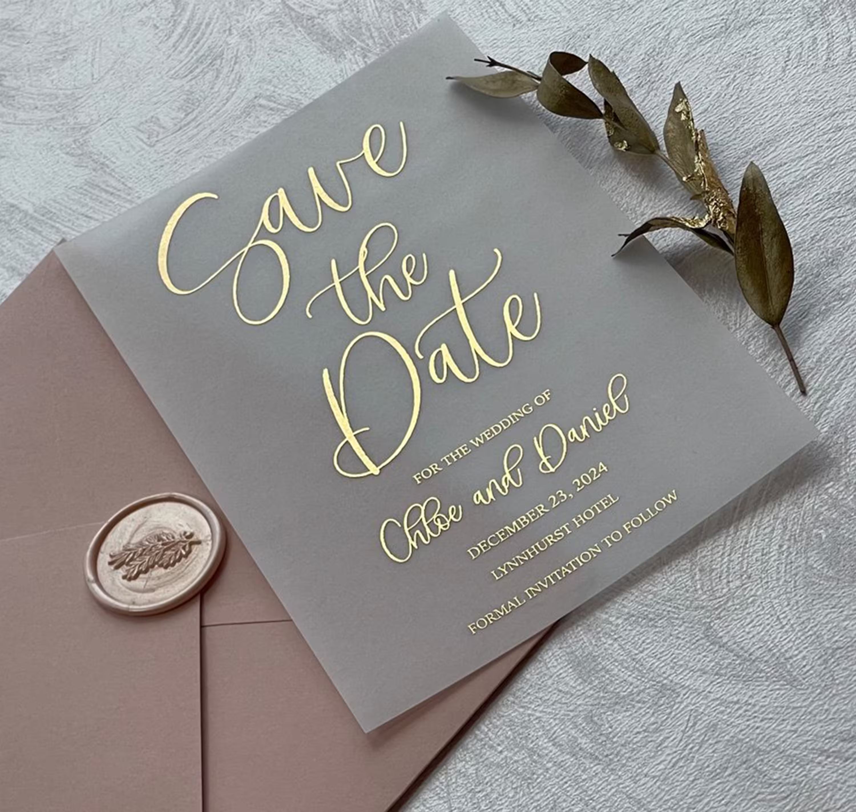 Vellum rose gold foil wedding Save the Date featuring flowing calligraphy