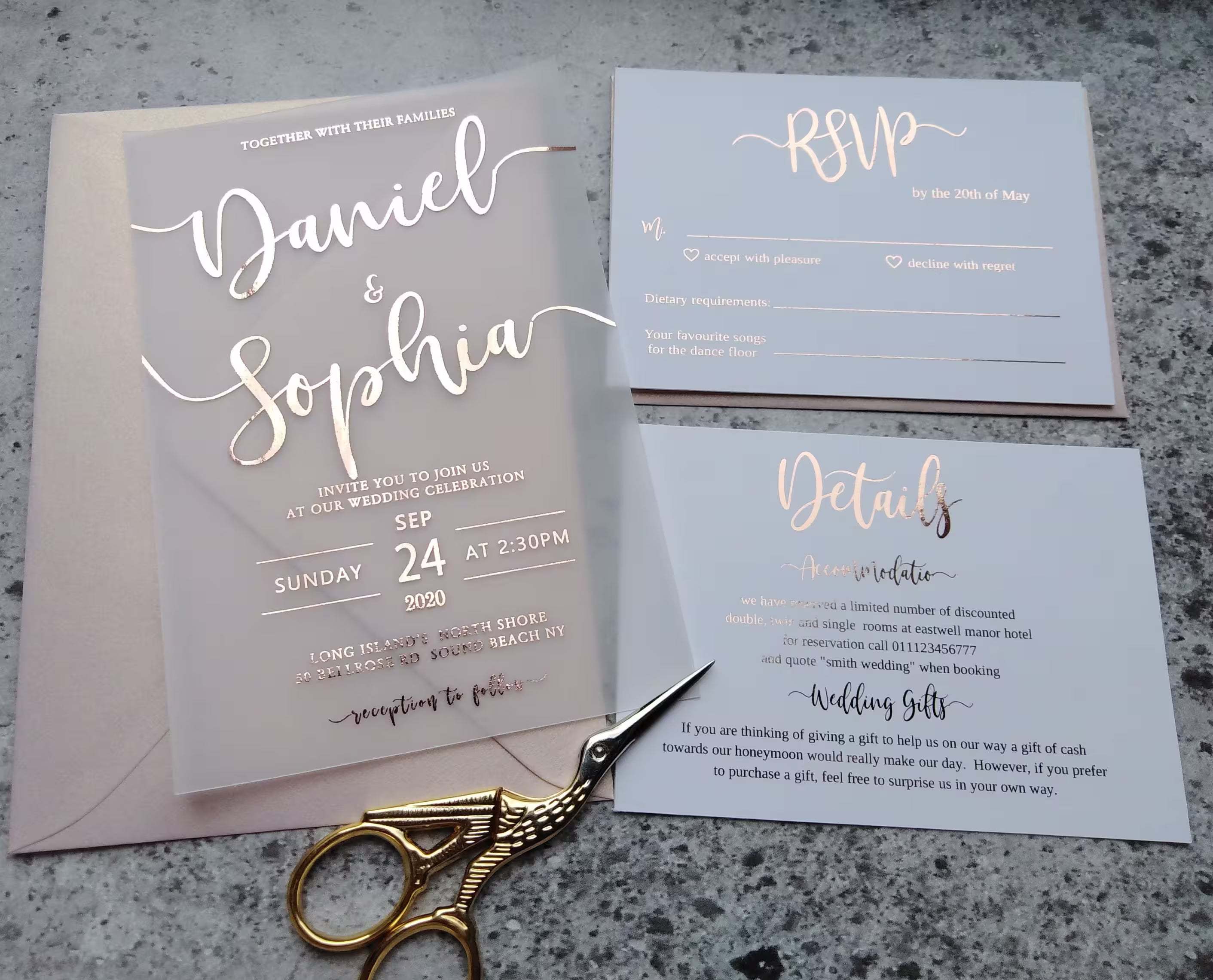 Vellum wedding invitation with rose gold foil calligraphy, blush envelope, and matching RSVP and details cards